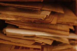 An image of back office manual process with lots of paperwork